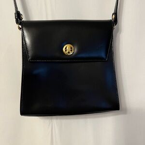 Chic Black Leather Crossbody Bag with Gold Accent
